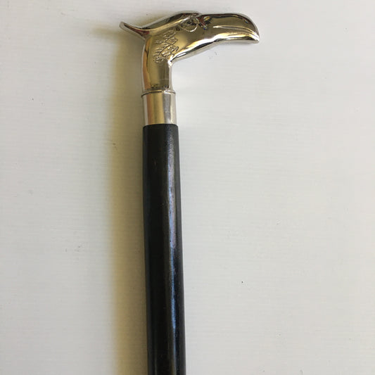 Walking Stick with Silver Eagles Head Handle on a Plain black stick