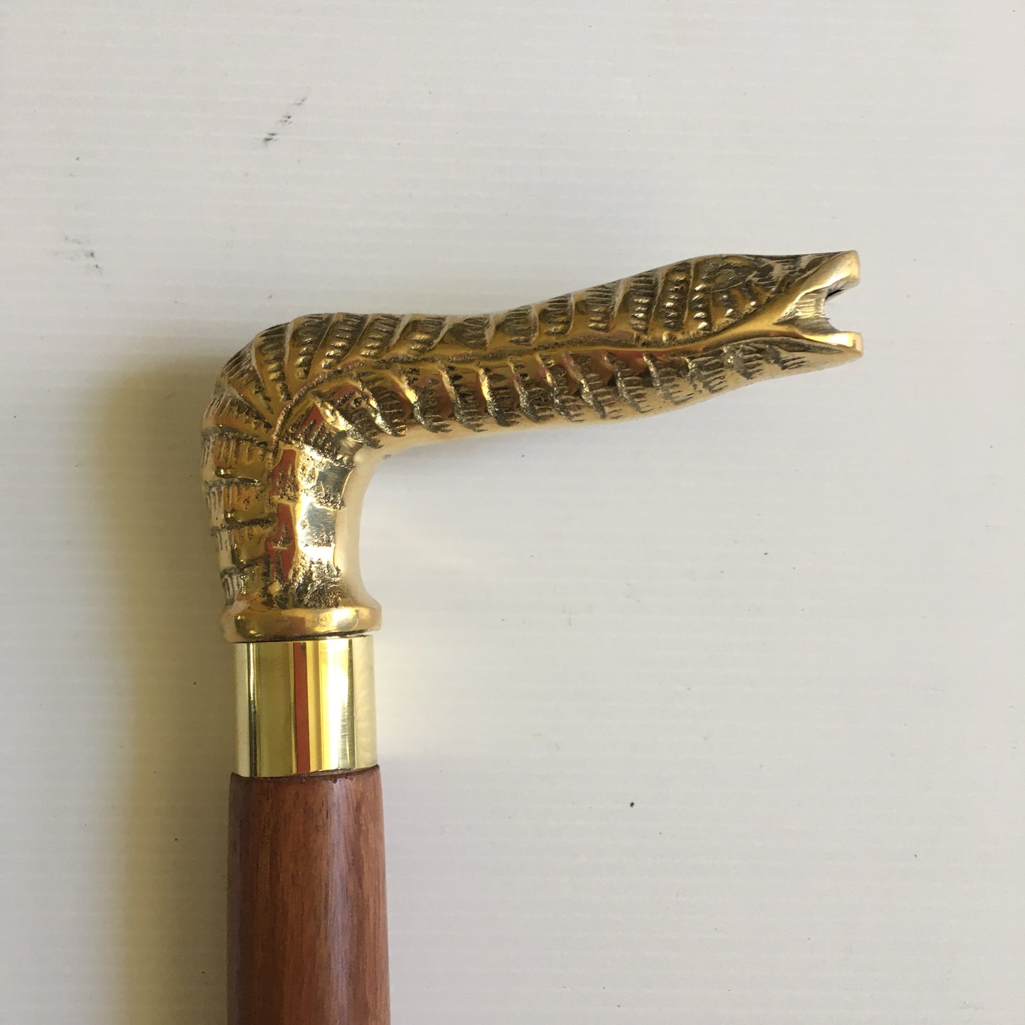 Walking Stick with Solid Brass Snakes Head Handle on a brown inlay stick