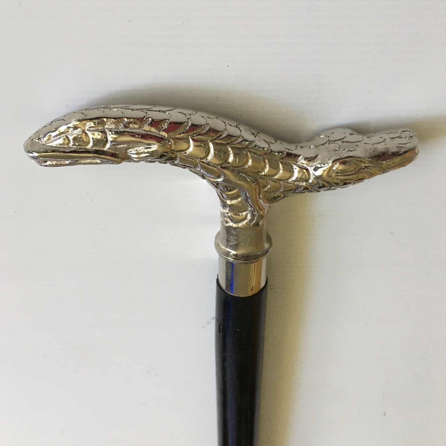 Walking Stick with comfortable Silver Crocodile Handle on a black stick