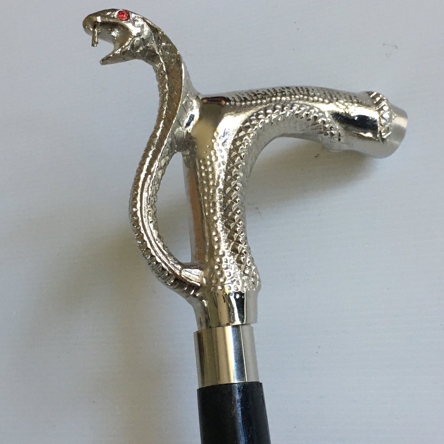 Walking Stick with Silver Snakes Head Handle on a black stick